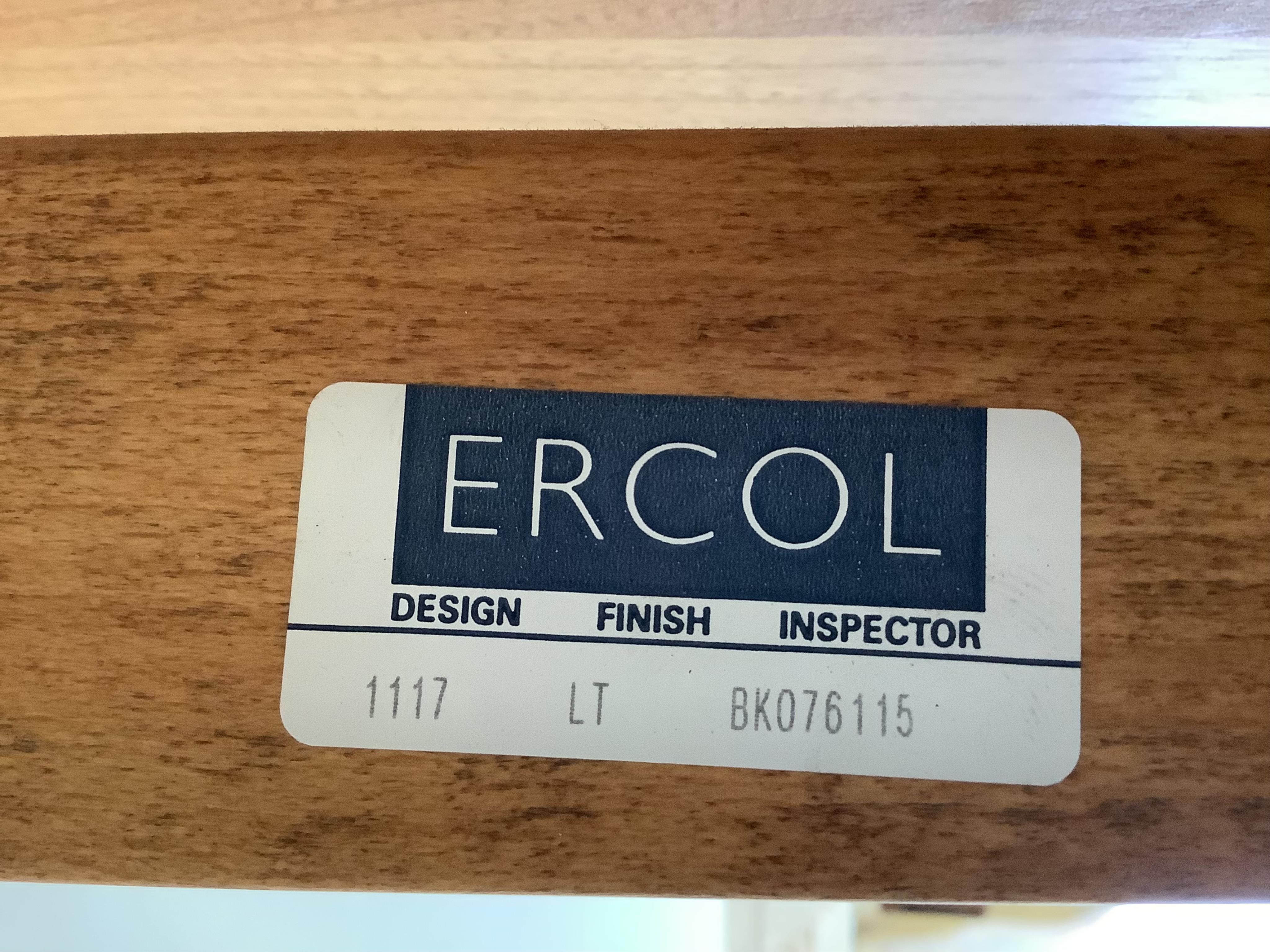 A modern Ercol elm dining table, width 110cm, depth 98cm, height 72cm (lacks spare leaf). Condition - good